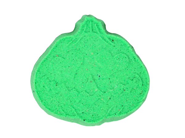 Green colored pumpkin shaped bath bomb with a jackolantern face and heart eyes