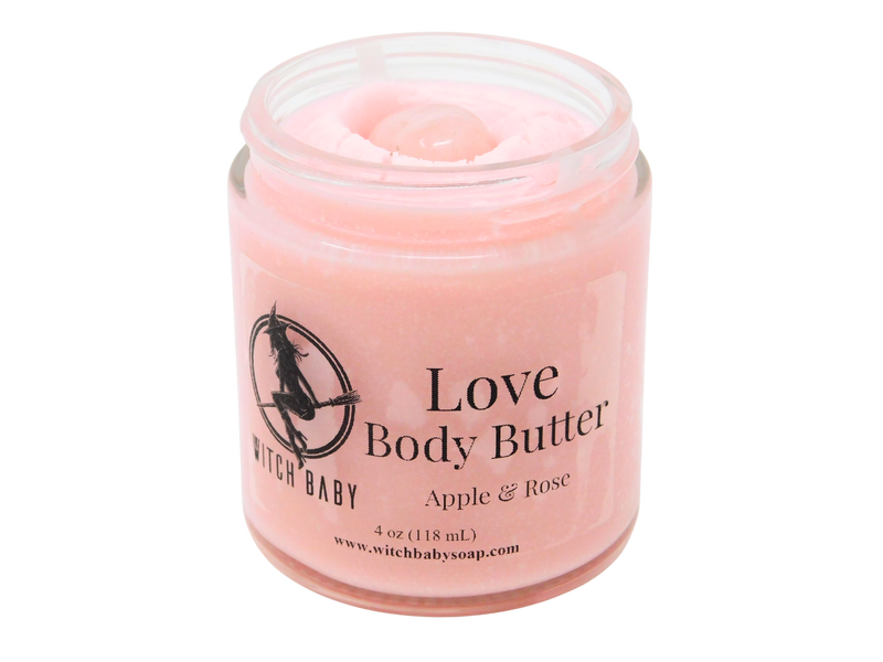 pink body butter packaged in glass jar with label that reads: Love Body Butter. Roses - Apples - Magick.