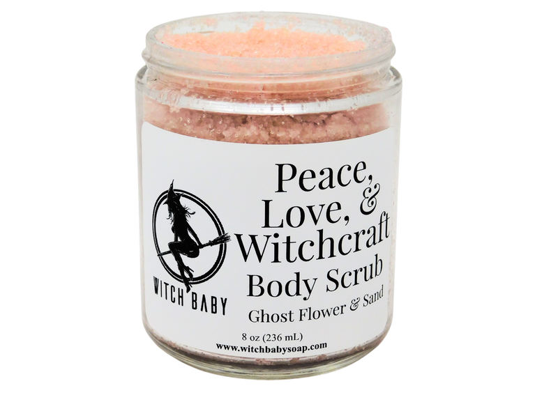 light pink scrub packaged in an 8 oz glass jar with a white label that reads: Peace, Love, & Witchcraft Body Scrub. Ghost Flower & Sand.