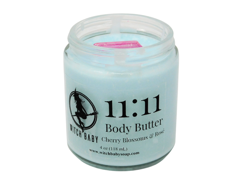 light blue body butter in a 4 oz glass jar with label that reads: 11:11 Body Butter. Cherry Blossoms & Rose.