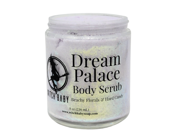 8 oz glass jar filled with lavender colored body scrub and gold glitter with clear label that reads: Dream Palace Body Scrub Beachy Florals & Hard Candy