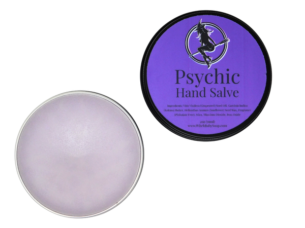 view of open tin of lavender colored hand salve with purple label that reads Psychic Hand Salve and ingredients