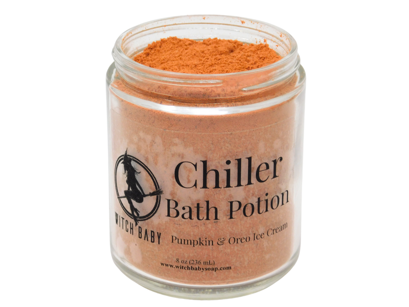 8 oz glass jar filled with dark october orange bubble bath dust. clear label reads: Chiller Bath Potion. Pumpkin & Oreo Ice Cream