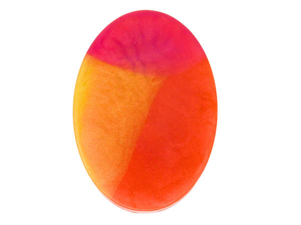 oval shaped soap with pink, yellow, and orange