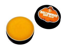 photo of hallowmas hand salve in black tin with pumpkin shaped label that reads hallowmas hand salve with ingredients listed and packaged in a black 2 oz tin