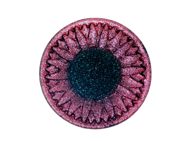 black sunflower shaped bath bomb with red glitter petals