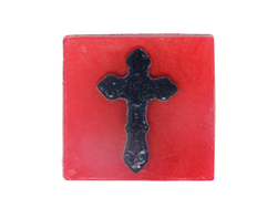 pink square shaped soap with black gothic cross