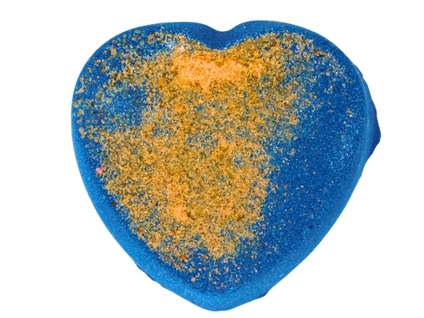 dark blue heart shaped bath bomb with gold himalayan salt on top;