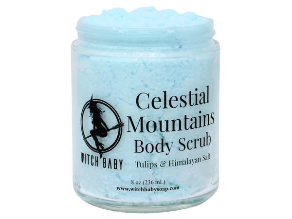 light blue thick body scrub in glass jar that reads: celestial mountains body scrub. tulips & himalayan salt.