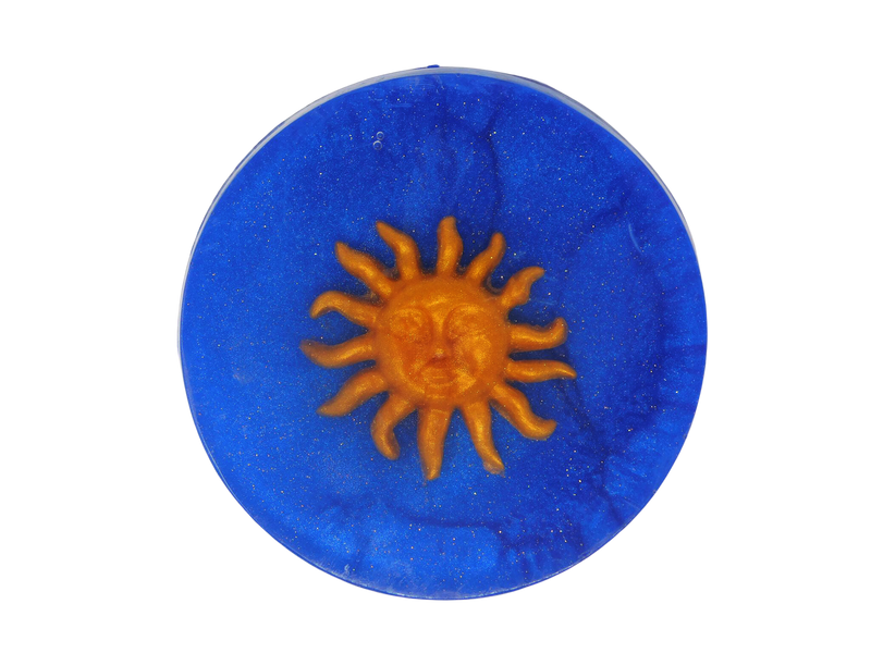 navy blue circular soap with gold sparkles and whimsigoth style gold sun sun on top