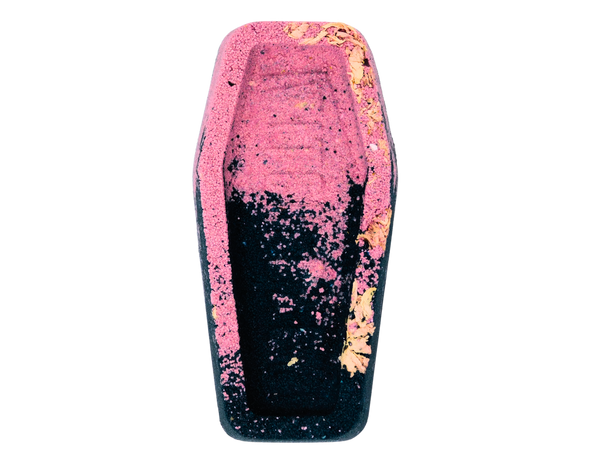 black and pink coffin bath bomb with cherry blossoms pressed on top
