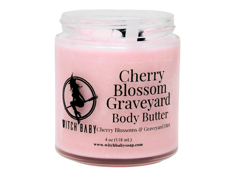 pink body butter in glass jar with clear label that reads Cherry Blossom Graveyard Body Butter. Cherry Blossoms & Graveyard Dirt. 
