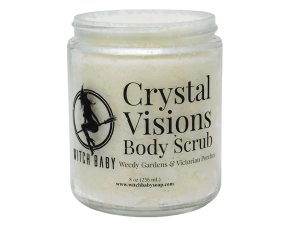 thick white body scrub in a glass jar with a label that reads Crystal Visions Body Scrub. Weedy Gardens & Victorian Porches.