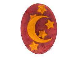 red oval shaped soap with moon and stars