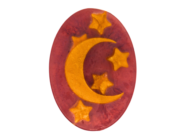 red oval shaped soap with moon and stars