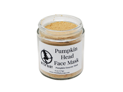 orange clay mask packaged in a 4 oz jar with white label that reads pumpkin head face mask. pumpkin enzyme mask. 