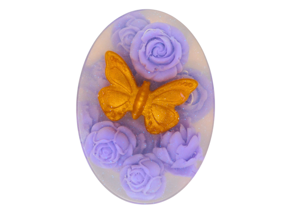 clear oval soap with gold butterfly and purple roses.