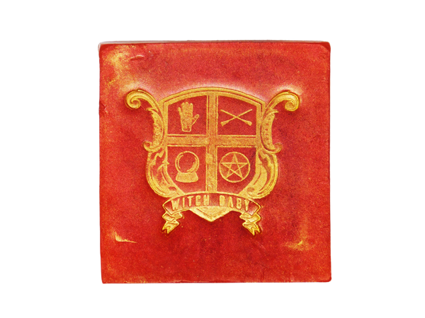 red square soap with witch baby crest on it
