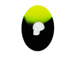 neon yellow and black oval soap with white skull on top