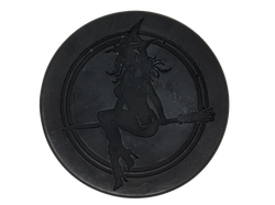 Circular black soap with witch baby logo on top