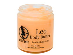 orange body butter topped with citrine in a 4 oz glass jar with clear label that reads: Leo Body Butter. Leo Birthday Cake. 