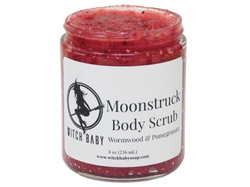 jam red scrub full of berry seeds packaged in an 8 oz glass jar with a white label that reads: Moonstruck Body Scrub. Wormwood & Pomegranate.