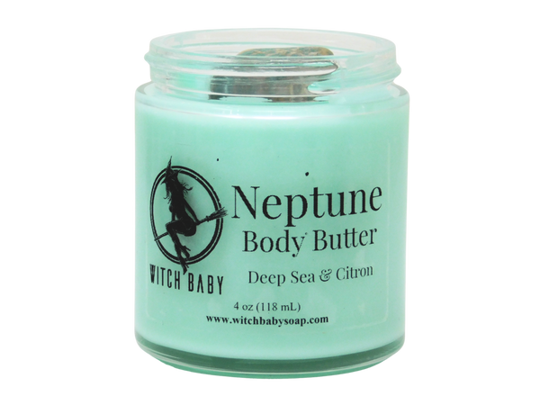 aqua blue body butter in a glass jar that reads: Neptune Body Butter Deep Sea & Citron
