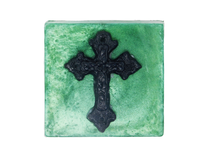 square shaped emerald green shimmering soap with a black gothic cross on top