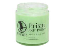 Green body butter made with Shea butter, coconut oil, and sunflower oil that smells like kiwi, starfruit, and tennis balls and topped with clear quartz.