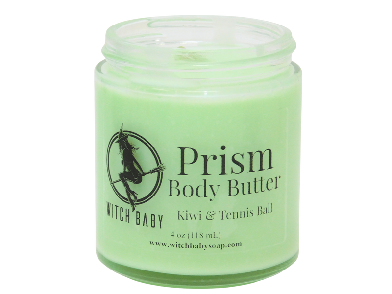 Green body butter made with Shea butter, coconut oil, and sunflower oil that smells like kiwi, starfruit, and tennis balls and topped with clear quartz.