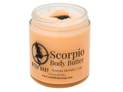 4 oz glass jar filled with orange body butter and topped with unakite. clear label reads: Scorpio Body Butter. Scorpio Birthday Cake. 
