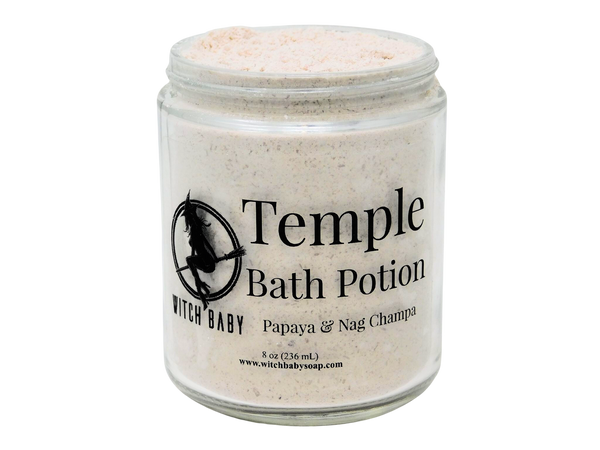 off white bath potion in 8 oz glass jar with clear label that reads : Temple Bath Potion. Papaya & Nag Champa.