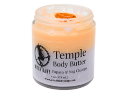 orange and purple body butter in 4 oz glass jar topped with carnelian. Clear label reads: Temple Body Butter. Papaya & Nag Champa. 