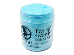 aqua blue shimmering thick moisturizing body scrub with clear lbale that reads: Two of Swords Body Scrub. Aqua - Jungle - Floral.