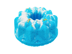 mercurial blue colored bundt cake bath bomb with fine glitter that looks like powdered sugar and glitter stars