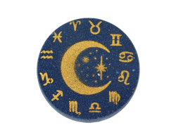 deep blue circular bath bomb air brushed with gold moon and stars surrounded by astrology symbols