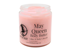 pink body butter packaged in a 4 oz glass jar with a clear label that reads May Queen Body Butter. Lilac & Baby Breath.