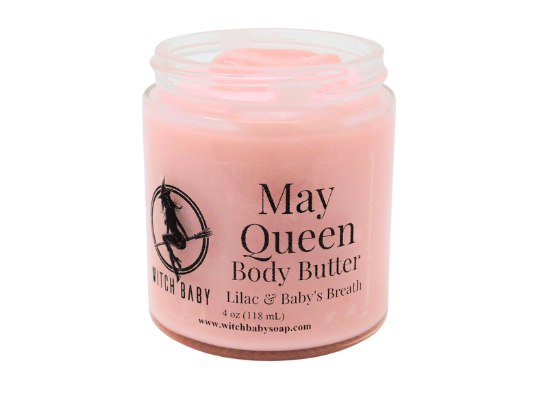 pink body butter packaged in a 4 oz glass jar with a clear label that reads May Queen Body Butter. Lilac & Baby Breath.