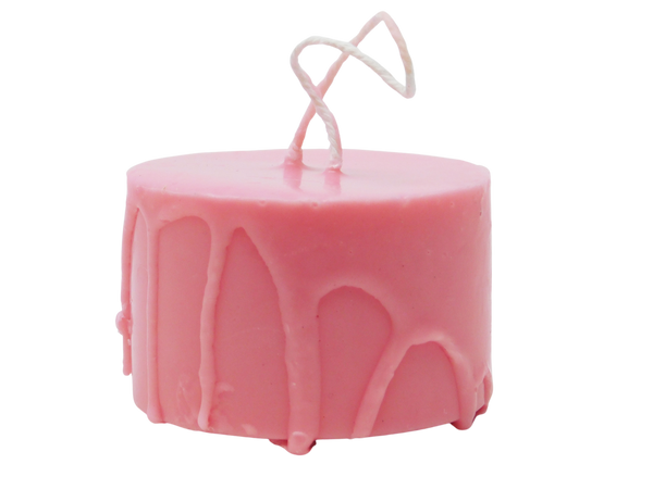 pink soap on a rope designed to look like a melty candle 