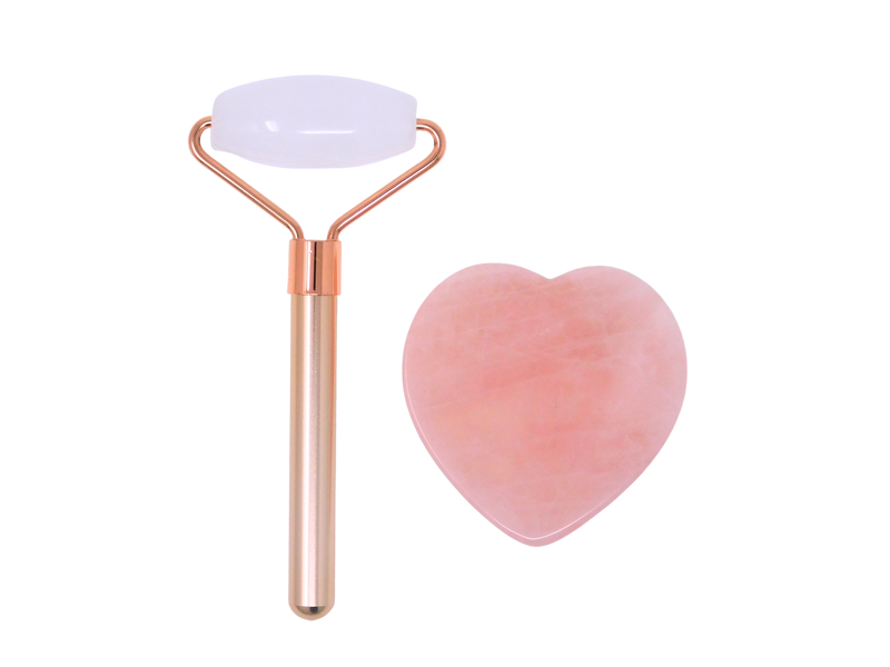 rose quartz face roller with rose gold colored handle and heart shaped rose quartz gua sha
