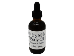 2 oz brown dropper bottle with white label that reads: Fairy Milk Body Oil. Flowers & Berries. 