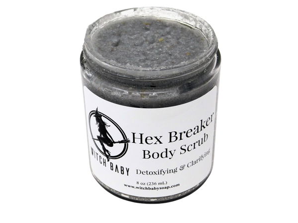 gray activated charcoal salt scrub in 8 oz glass jar with a label that reads: Hex Breaker Body Scrub. Detoxifying & Clarifying.