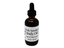 2 oz amber colored glass dropper bottle with label that say holy smokes body oil sage and palo santo