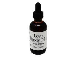 brown glass dropper bottle with label that reads: Love Body Oil. Apple & Rose. 