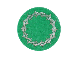 green puck bath bomb with metal ring of thorns airbrushed on top