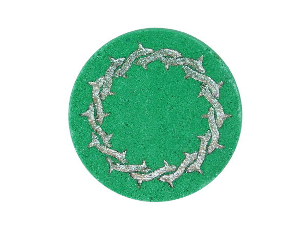 green puck bath bomb with metal ring of thorns airbrushed on top