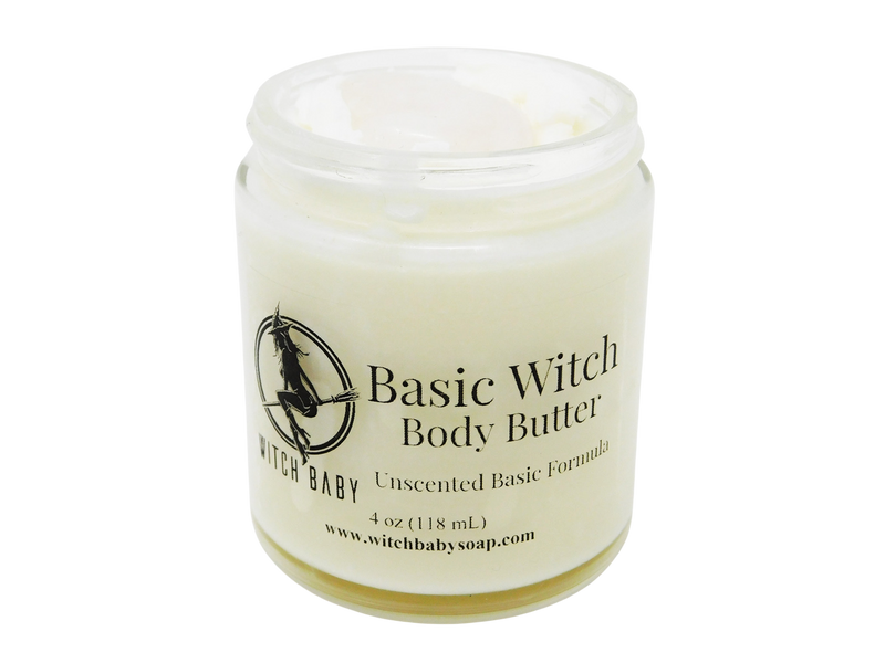 4 oz glass jar containing white body butter topped with milk quartz. Label says unscented basic formula. 