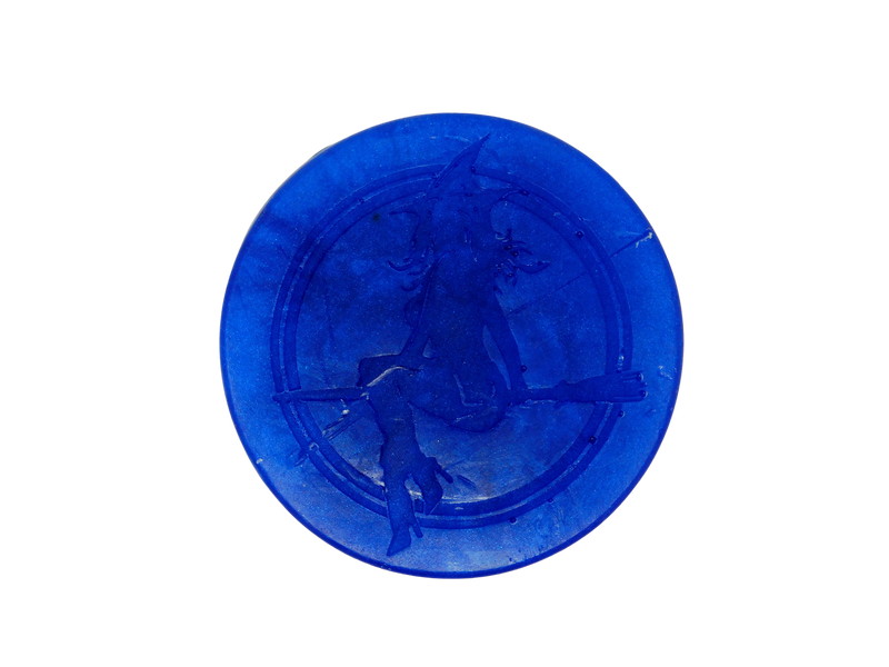 circular deep blue soap with the witch baby logo engraved on top