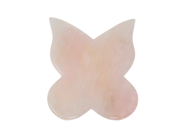rose quartz gua sha in the shape of a butterfly