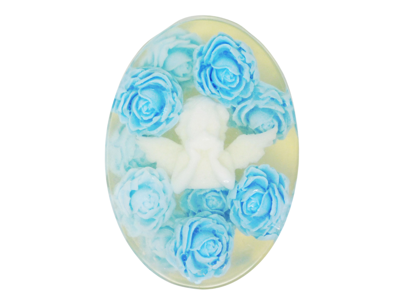 Oval clear soap with a white angel at the center surrounded by sky blue roses